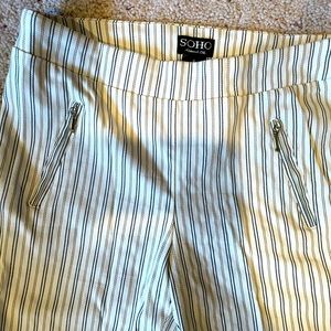 white stretch denim skinny pants. Pin stripes Small, zip up pockets